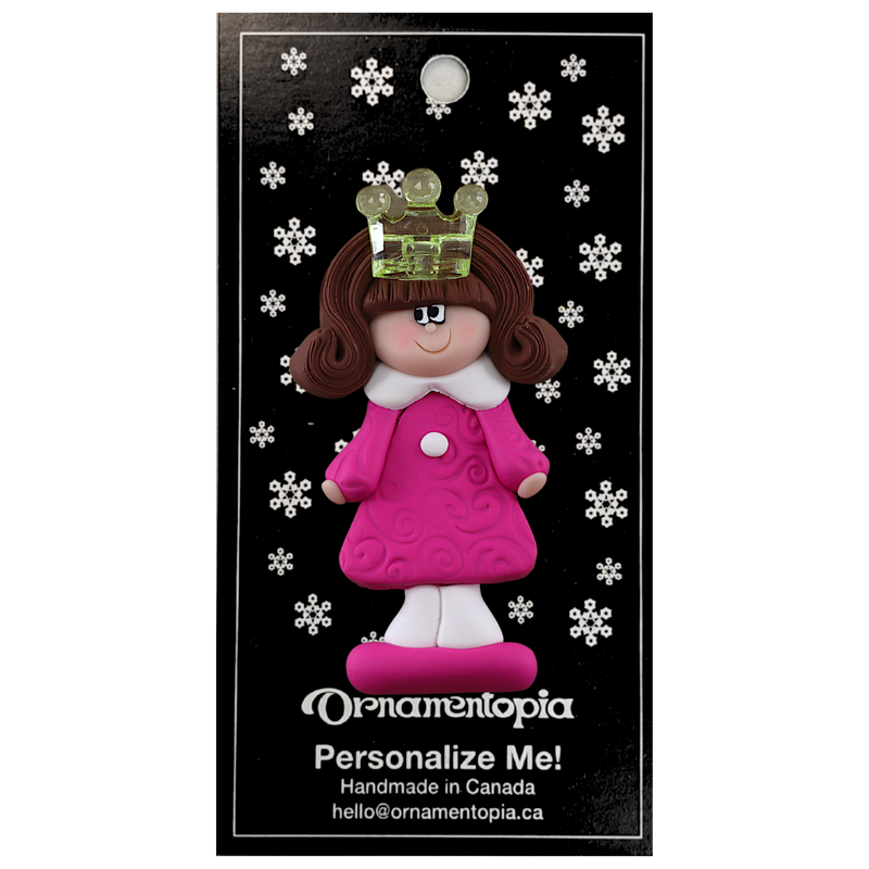 Pink princess with crown and brown hair ornament, on display backing card.