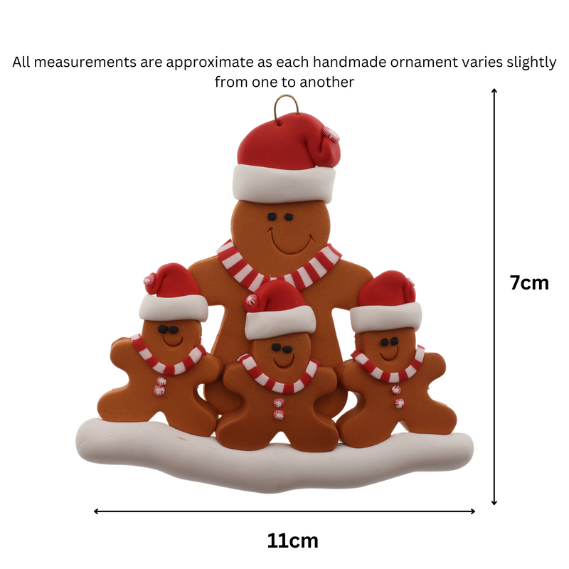 Family ornament with 1 large and 3 small brown gingerbread figures in red Christmas hats, graphed to show size (11x7cm).