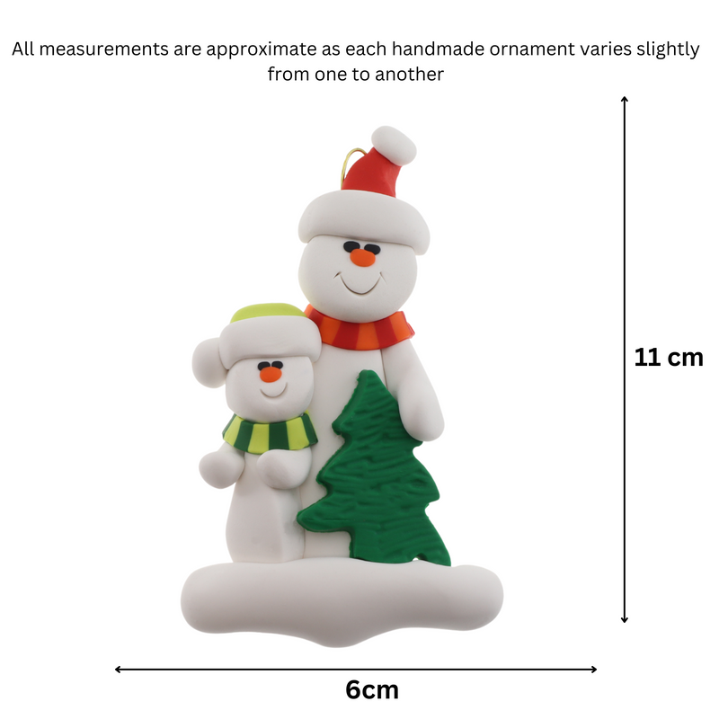 Family ornament with 1 large and 1 small white snowman in bright scarves, with green Christmas tree, graphed to show size (6x11cm).