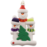 Family ornament with 1 large and 2 small white snowmen in bright scarves, with green Christmas tree.