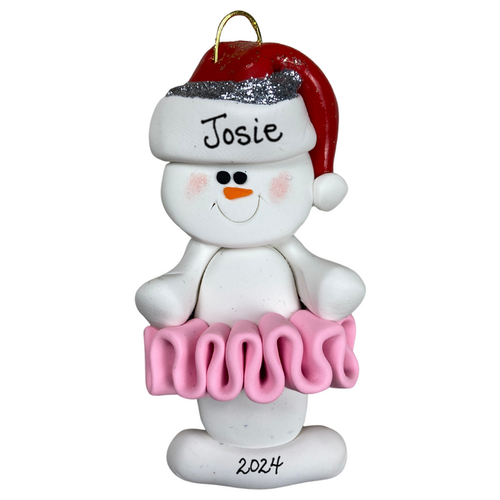 Ornament of white snowman in red hat wearing a pink tutu, personalized with name.