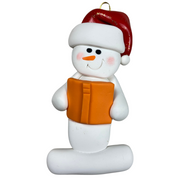 Ornament of white snowman in red hat holding an orange book.