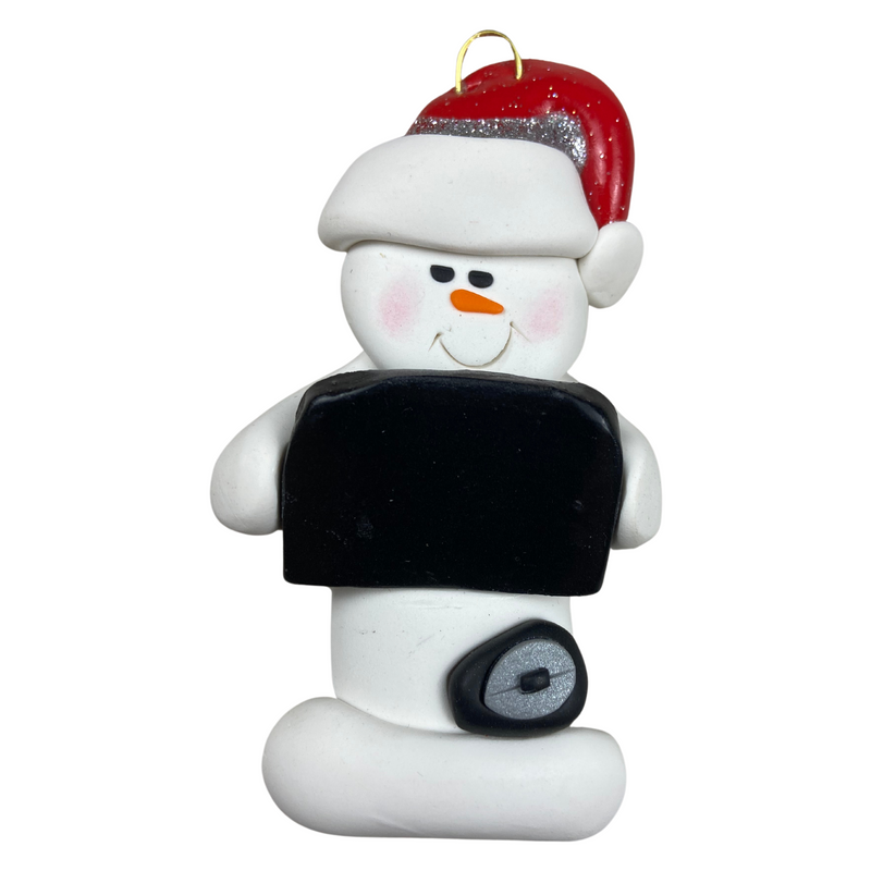 Ornament of white snowman in red hat holding black laptop and a computer mouse.