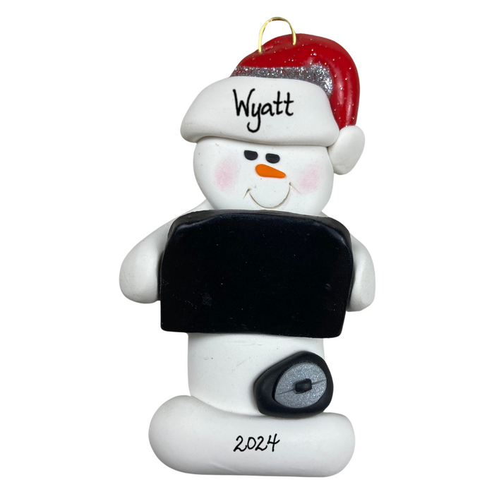 Ornament of white snowman in red hat holding black laptop and a computer mouse, personalized with name.