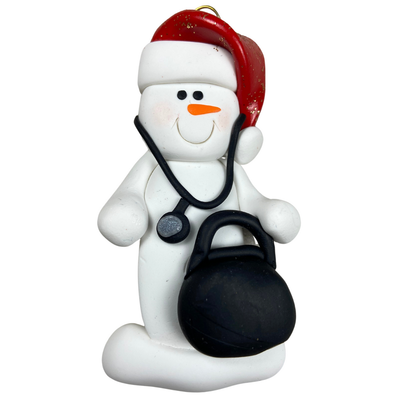 Ornament of white snowman in red hat holding a stethoscope and black medical bag.