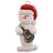Ornament of white snowman in red hat holding a colourful guitar.