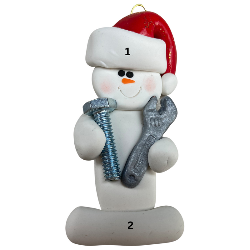 Ornament of white snowman in red hat holding a wrench and a screw, numbered 1-2 for personalization.