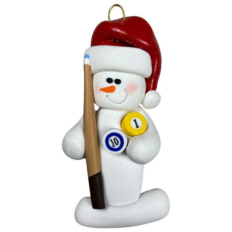 Ornament of white snowman in red hat holding a pool cue and pool balls.