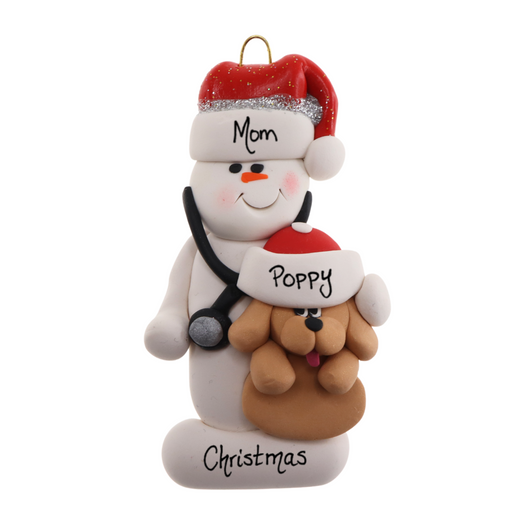Ornament of white snowman in red hat holding a tan dog and stethoscope, personalized with names.
