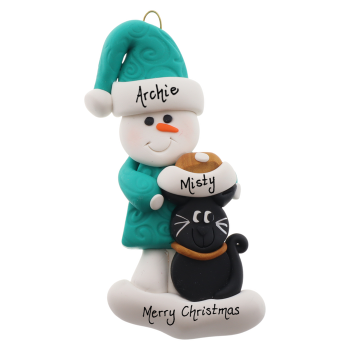 Ornament of snowman in a green shirt and hat with black cat in Christmas hat, personalized with names.