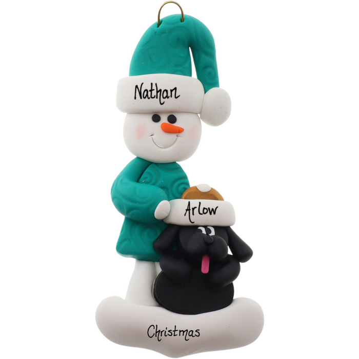 Ornament of snowman in green shirt and hat with black dog in Christmas hat, personalized with names.
