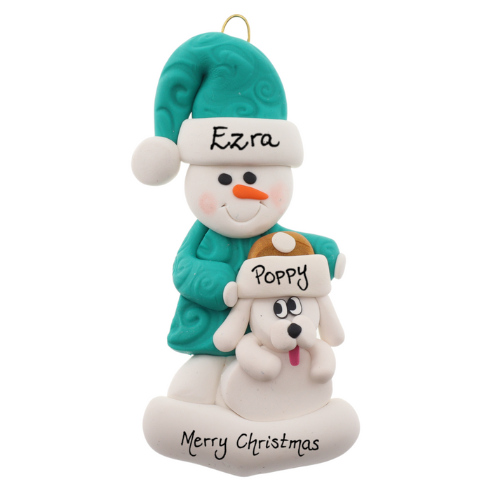 Ornament of snowman in green shirt and hat with white dog in Christmas hat, personalized with names.