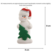 White snowman in red festive hat with green Christmas tree ornament, graphed to show size (4x9cm).