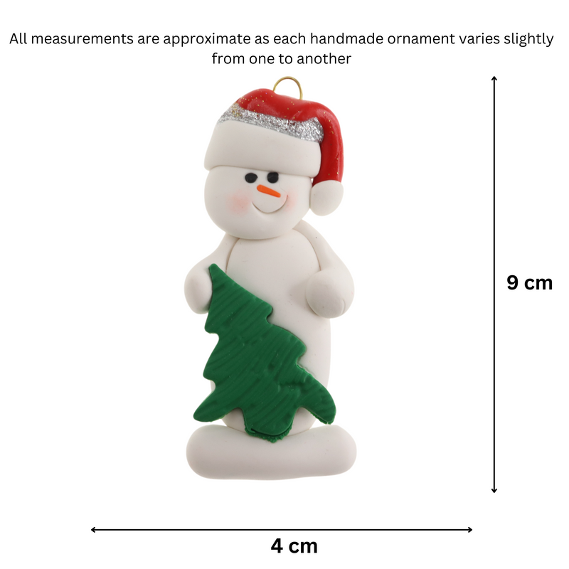 White snowman in red festive hat with green Christmas tree ornament, graphed to show size (4x9cm).