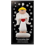 Tall angel wearing white with blonde hair ornament, on display backing card.