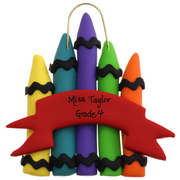 Stack of crayons joined with red ribbon teacher appreciation ornament, personalized with name.