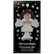 Angel wearing white with brown hair ornament, on display backing card.