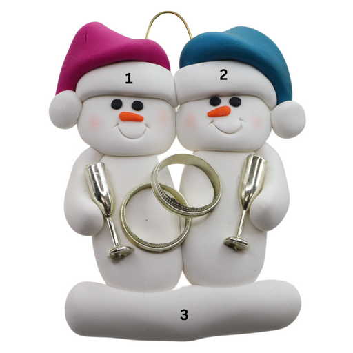 A couple’s ornament of two white snowmen holding gold rings and goblets, numbered 1-3 for personalization.