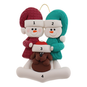 Ornament of snowman couple in red and green shirts and hats with brown dog in Christmas hat, numbered 1-4 for personalization.