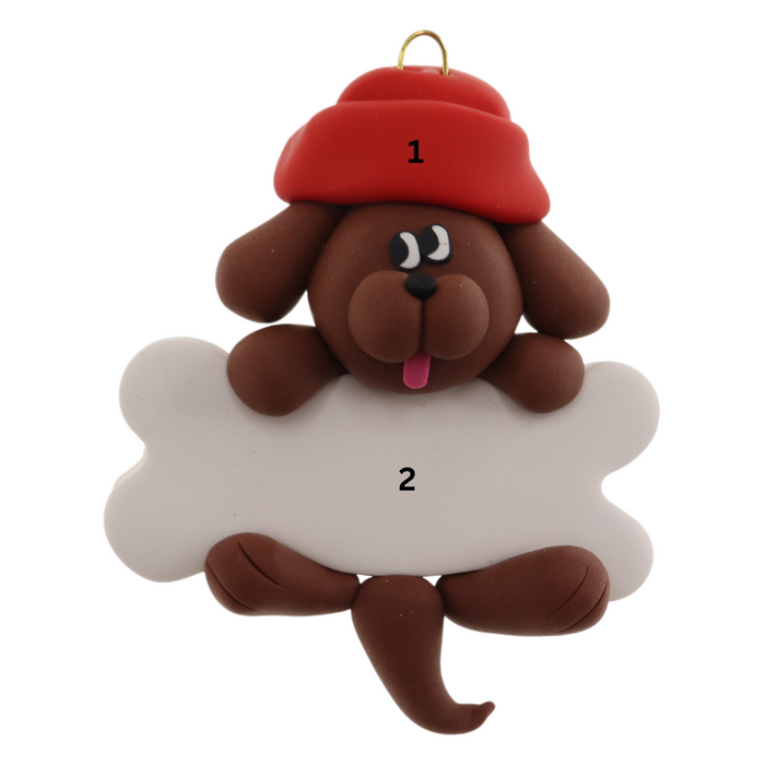 Ornament of brown dog in red hat hanging on a white bone, numbered 1-2 for personalization.