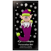 Elf poking out of magenta stocking ornament, on display backing card.