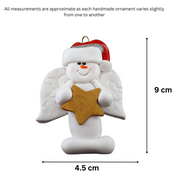 Ornament of white snowman in red hat with angel wings and a golden star, graphed to show size (4.5x9cm).