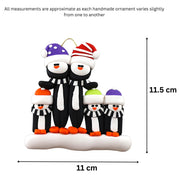Family ornament with 5 black and white penguins in colourful festive hats, graphed to show size (11x11.5cm).