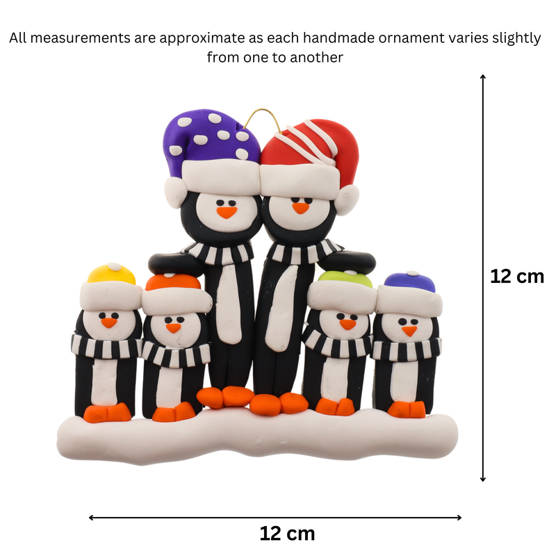 Family ornament with 6 black and white penguins in colourful festive hats, graphed to show size (12x12cm).