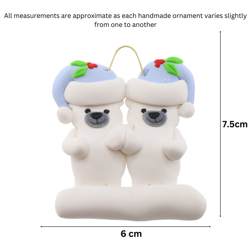 Family ornament with 2 polar bear figures in blue Christmas hats, graphed to show size (6x7.5cm).