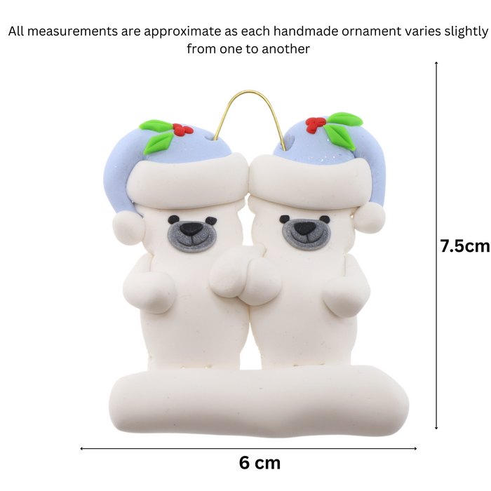 Family ornament with 2 polar bear figures in blue Christmas hats, graphed to show size (6x7.5cm).