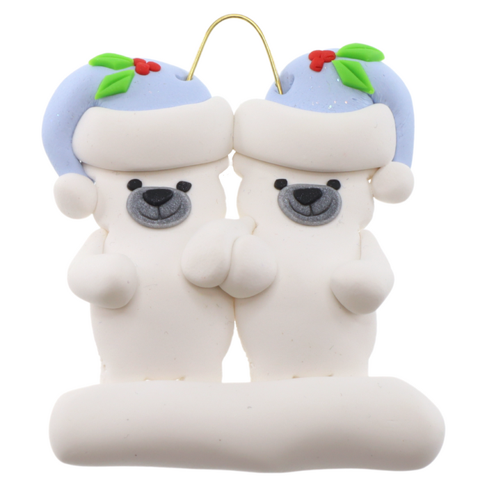 Family ornament with 2 polar bear figures in blue Christmas hats.