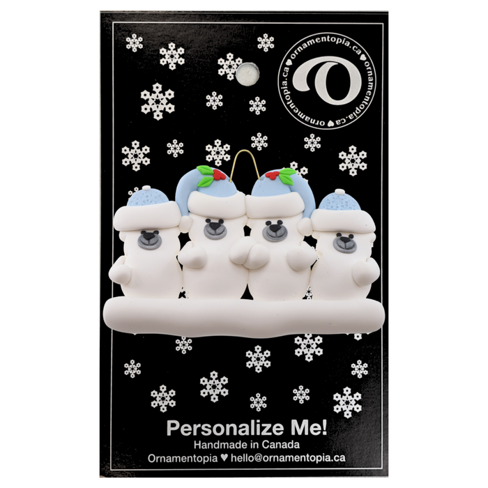 Family ornament with 4 polar bear figures in blue Christmas hats, on display backing card.