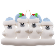 Family ornament with 4 polar bear figures in blue Christmas hats.