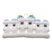 Family ornament with 6 polar bear figures in blue Christmas hats.