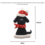 Ornament of black dog in a red and white polka dot Christmas hat and scarf, graphed to show size (6x9.5cm).