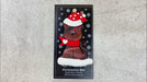 Ornament of brown cat in red and white polka dot Christmas hat and scarf, shown on backing card and Christmas tree.