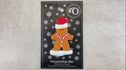 Gingerbread cookie ornament, shown on backing card and Christmas tree.