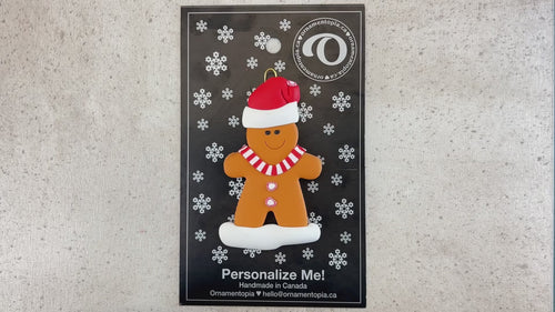 Gingerbread cookie ornament, shown on backing card and Christmas tree.