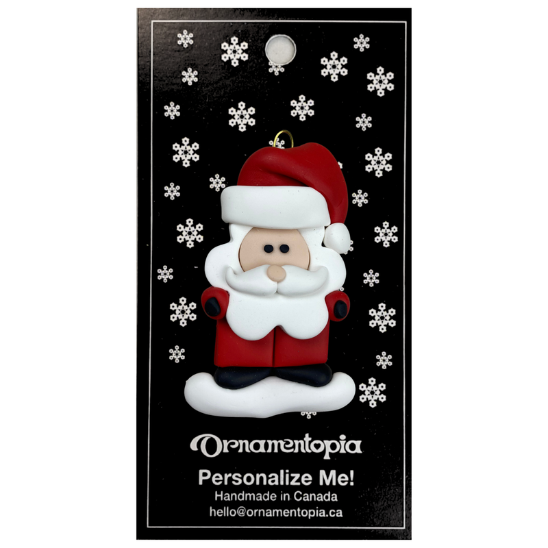 Santa with red festive hat ornament, on display backing card.