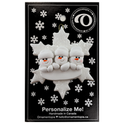 Family ornament with 3 white snowmen stacked on top of a glitter white snowflake, on display backing card.
