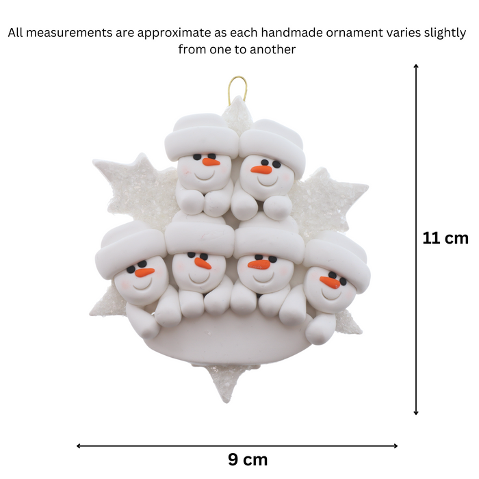 Family ornament with 6 white snowmen stacked on top of a glitter white snowflake, graphed to show size (9x11cm).