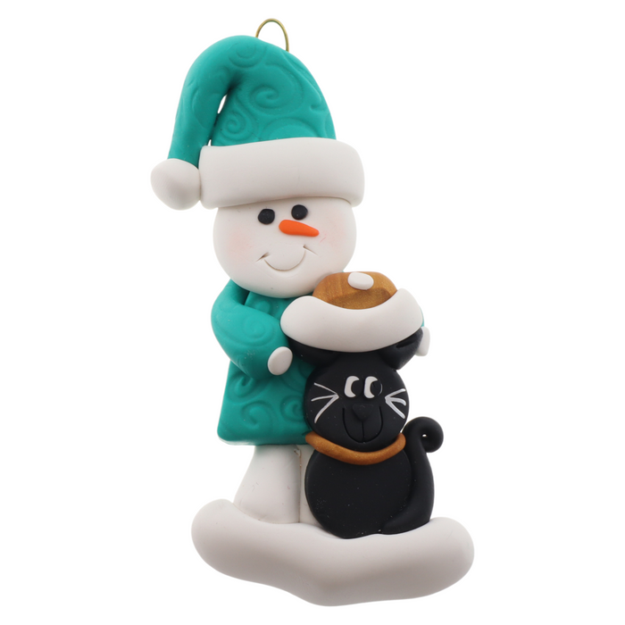 Ornament of snowman in a green shirt and hat with black cat in Christmas hat.