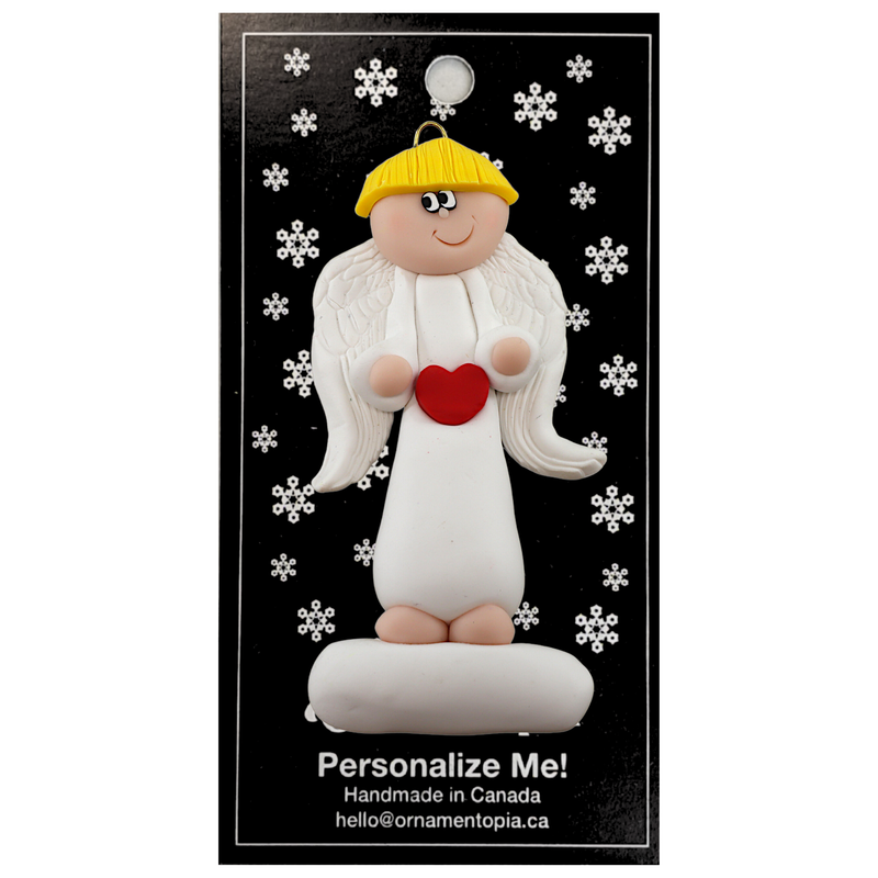 Tall angel wearing white with blonde hair ornament, on display backing card.